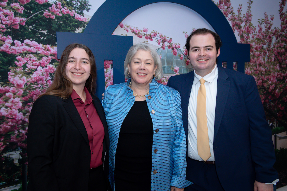 GW President Ellen Granberg with two alumni
