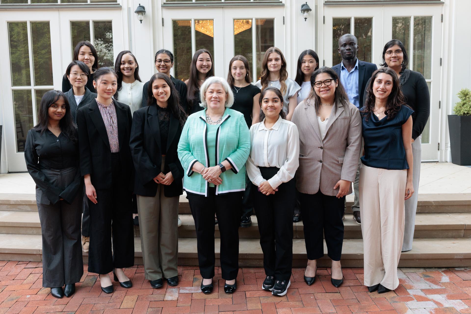 President Granberg poses for a photo with students and other guests