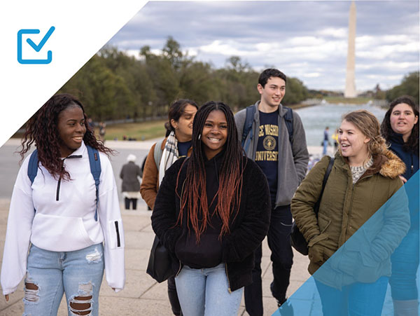 Students walking by the mall reflecting pool; Washington Monument in the background