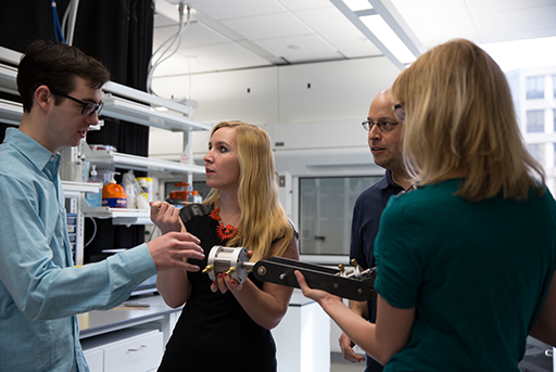 Professor Megan Leftwich works with students in a SEAS lab.
