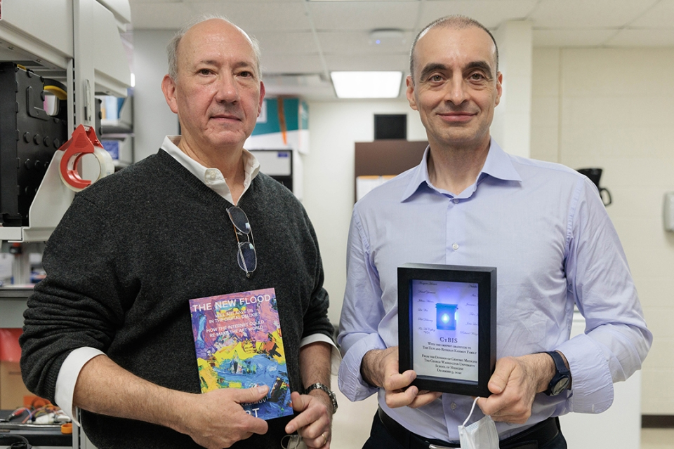 Timothy McCaffrey (l) and Ulvi M. Kasimov tour Dr. McCaffery’s lab where he is developing a RNA-based diagnostic device.